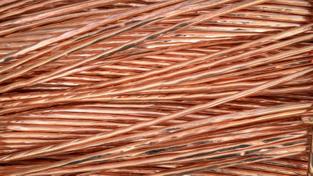 Interwoven copper wires showcasing complex twists and reflective textures.