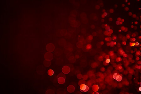 Luxury Red Bokeh with gold light on black backgroundの写真素材