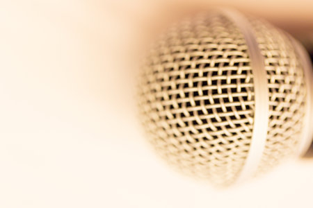 Close up of microphone on a podium in an auditorium with vintage backgroundの写真素材