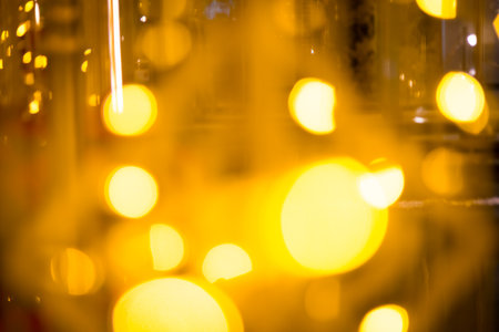 close-up blurred photo Golden decorative lights create a luxurious atmosphere at night events. Helps to take beautiful, easy and interesting photos.の写真素材