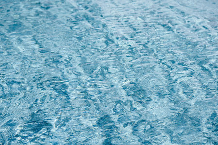 abstract blue color water wave in swimming pool pure natural swirl pattern texture use for backgroundの写真素材