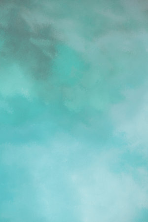 Abstract brush stroke painting featuring a blend of blue, purple, and green hues with a textured appearance.の写真素材