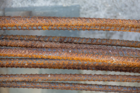 Close-up of a concrete foundation with a steel rebar cage inside, prepared for construction. Shows the initial stage of building supportの写真素材