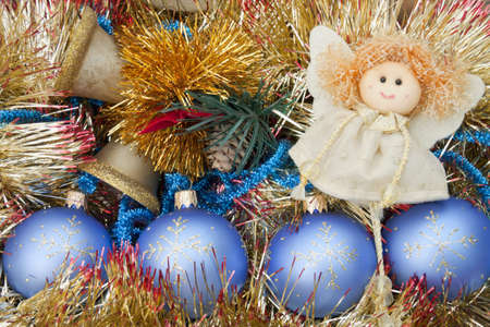 Fur-tree toys lay in a box with ornaments to Christmasの写真素材