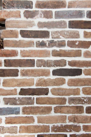 Brick wall; it is painted in different colourの写真素材