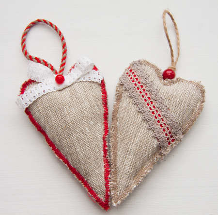 Hearts from a canvas on the white. A multi-coloured border. Day of Valentine. Toys on the Fur-treeの写真素材