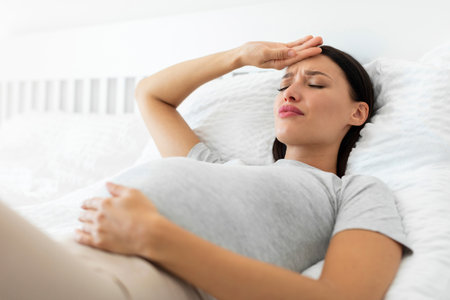 Holiday celebration. Loving young couple exchanging gifts, happy lady embracing present box, man and woman celebrating Christmas and New year at homeの写真素材