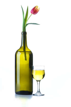 Wine bottle with a flowerの写真素材