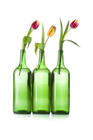 Wine bottle with a flowerの写真素材