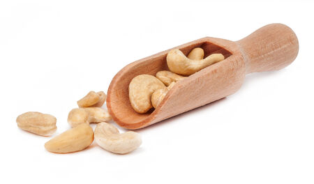 cashew scoop isolated on white backgroundの写真素材