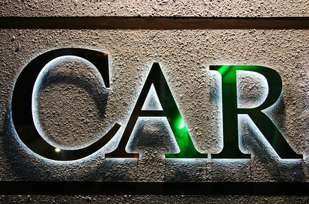CAR word glow on textured wallの写真素材