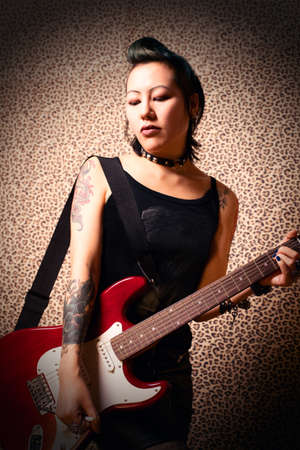 Gothic girl with guitarの写真素材