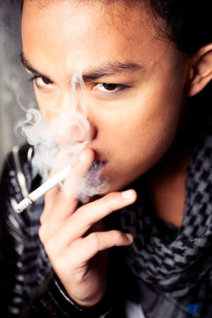 Young man smokingの写真素材