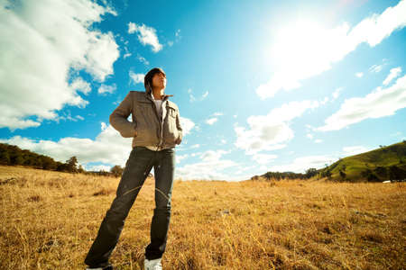 Young man rest on golden field.の写真素材
