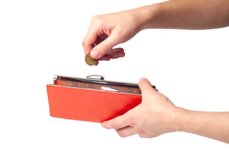 Hands holding coin and orange wallet, isolated on white backgroundの写真素材