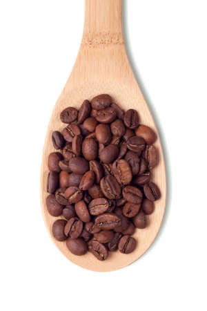Wooden spoons with coffee beans on white backgroundの写真素材