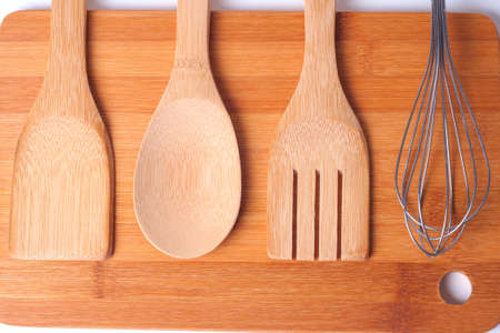 Top view of wooden kitchen utensils on wood boardの写真素材