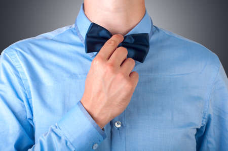 Man corrects bowtieの写真素材