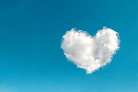 Cloud in the shape of a heart in the blue skyの写真素材