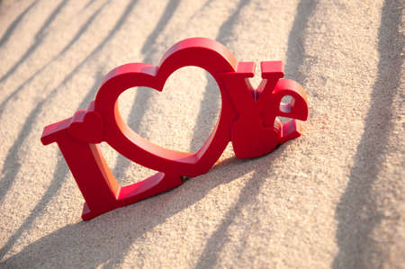 The word love and the sand in the backgroundの写真素材