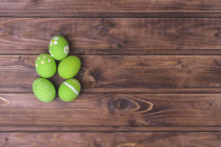 Easter eggs on a dark wooden backgroundの写真素材