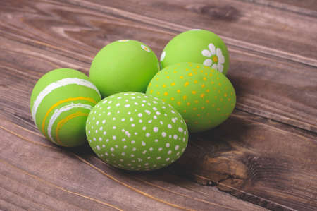 Easter eggs on a dark wooden backgroundの写真素材