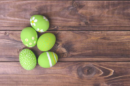Easter eggs on a dark wooden backgroundの写真素材