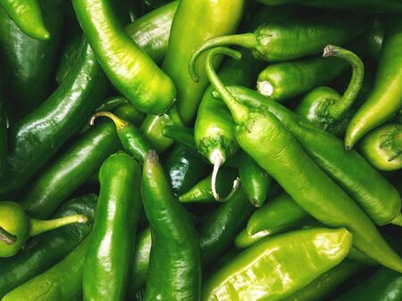 Green, hot chili peppers, full screen closeupの写真素材