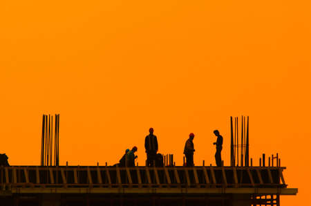 Builders on a construction site for a new buildingの写真素材