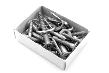 Isolated screws in box on white backgroundの写真素材