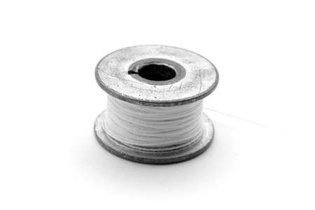 Metal spool on white backgroundの写真素材