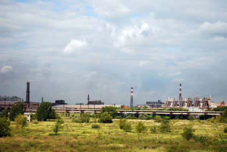 Metallurgy manufactory, pipes & sky with cloudsの写真素材