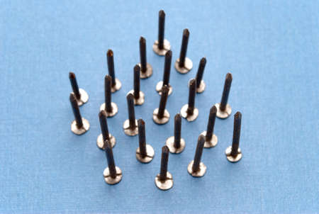 Isolated nails on blue backgroundの写真素材