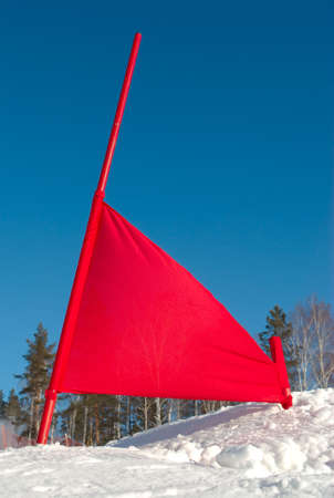 A red flag on a ski slopeの写真素材