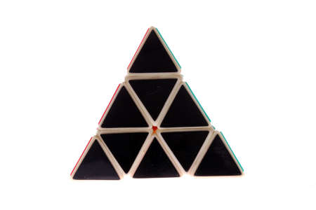 A toy in the shape of a triangle made of black triangles, isolated on a white backgroundの写真素材