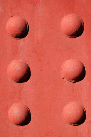 A red background with raised circles.の写真素材