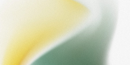 A grainy abstract background features a diagonal gradient. Yellow, green, and white colors blend softly. The composition has a subtle texture with a minimal style.の写真素材