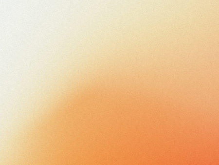 A close-up view of a textured surface with a gradient of orange and white hues