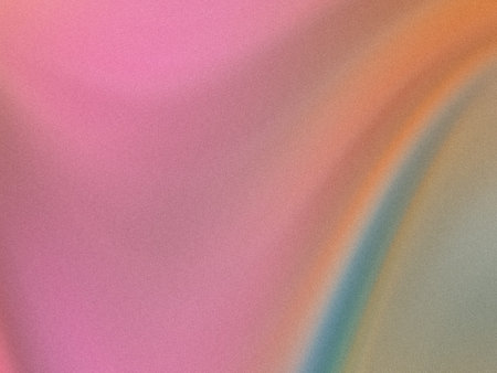 This image showcases a gradient transition between soft pastel colors, primarily pink, lavender, and mint green, on a smooth and slightly textured surface. The gradient flows seamlessly from one hue to another, creating a calming and harmonious visual effect. The texture appears subtle, giving a gentle, almost velvety feel to the overall appearance.の写真素材