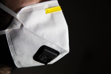 Doctor safety mask and corona virus protection isolated on a black backgroundの写真素材