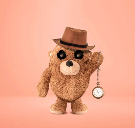 The plush bear is waving an antique pocket watch. Fedora. The plush bear character has been reinterpreted with photo manipulation. Cute plush bear. 3D drawing. Plush bear character design.の写真素材