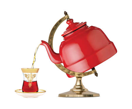 In the world atlas, the teapot pours tea into the glass. Creative photo manipulation. 3D illustration.の写真素材