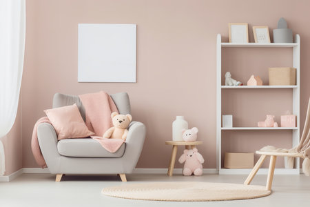 Pink and white themed nursery with a gray armchair, bookshelf, and toys on a round rug. The room has a large window and light-colored wallsの素材
