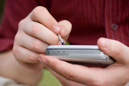 Taking notes on PDAの写真素材