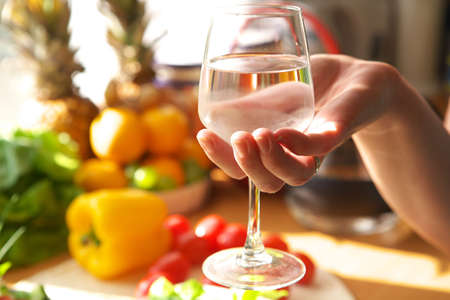 Glass of water in handの写真素材