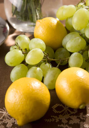 Fresh fruits lemon and grapesの写真素材