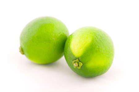 Fresh lime fruits isolated on white