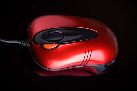 Computer mouse on reflective backgroundの写真素材