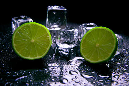 Lime fruits with ice cubesの写真素材