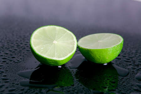 Lemon fruits on reflective background